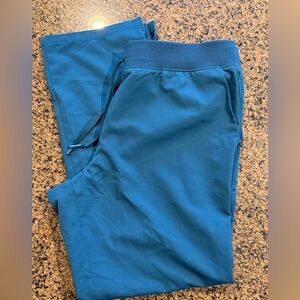 Jaanuu women’s Sz XL Caribbean Blue flare leg scrub pants. NWOT